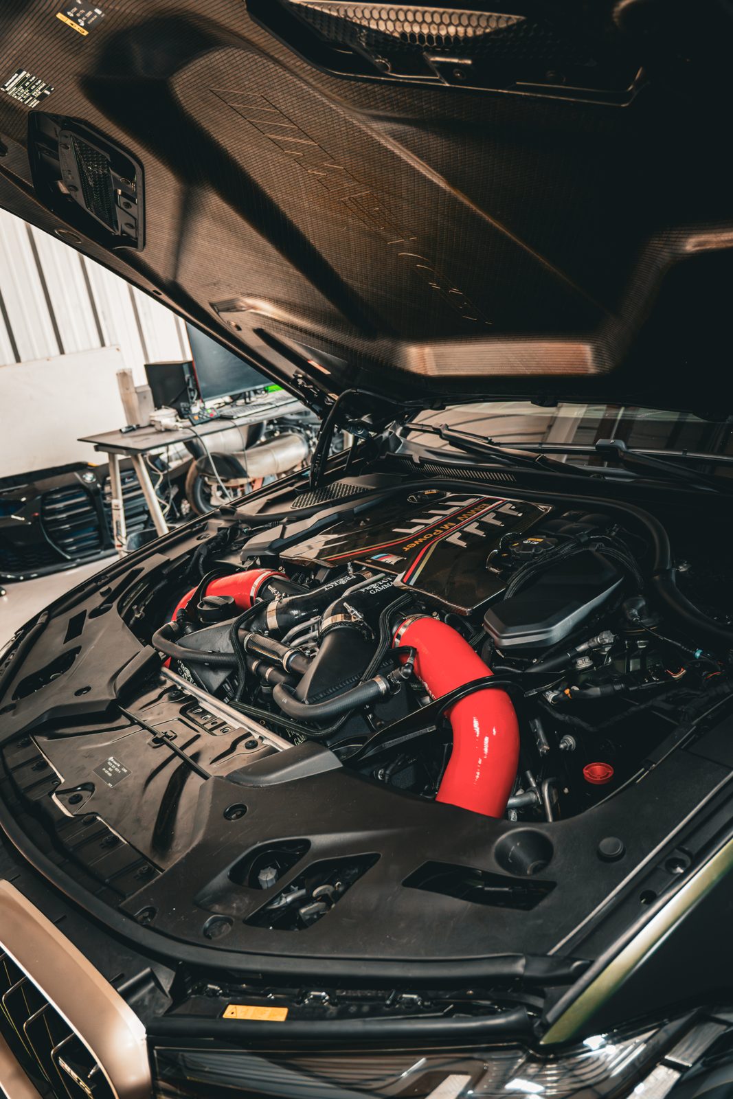 Twin-turbo BMW engine bay being serviced at Cruz Automotive