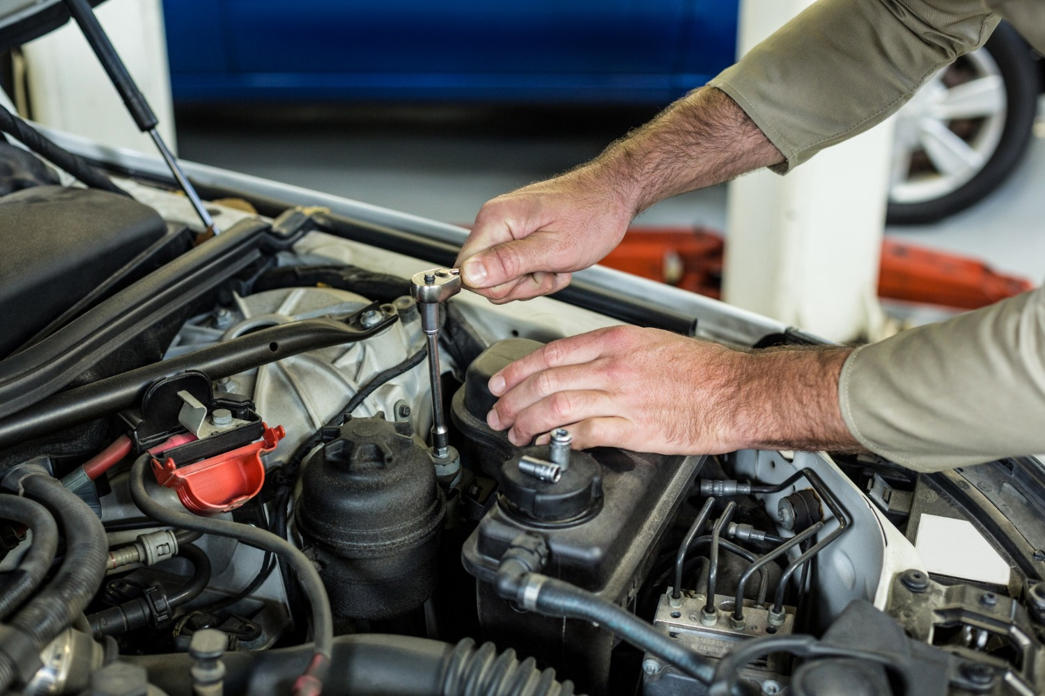 Technician performing precision engine work with a socket wrench