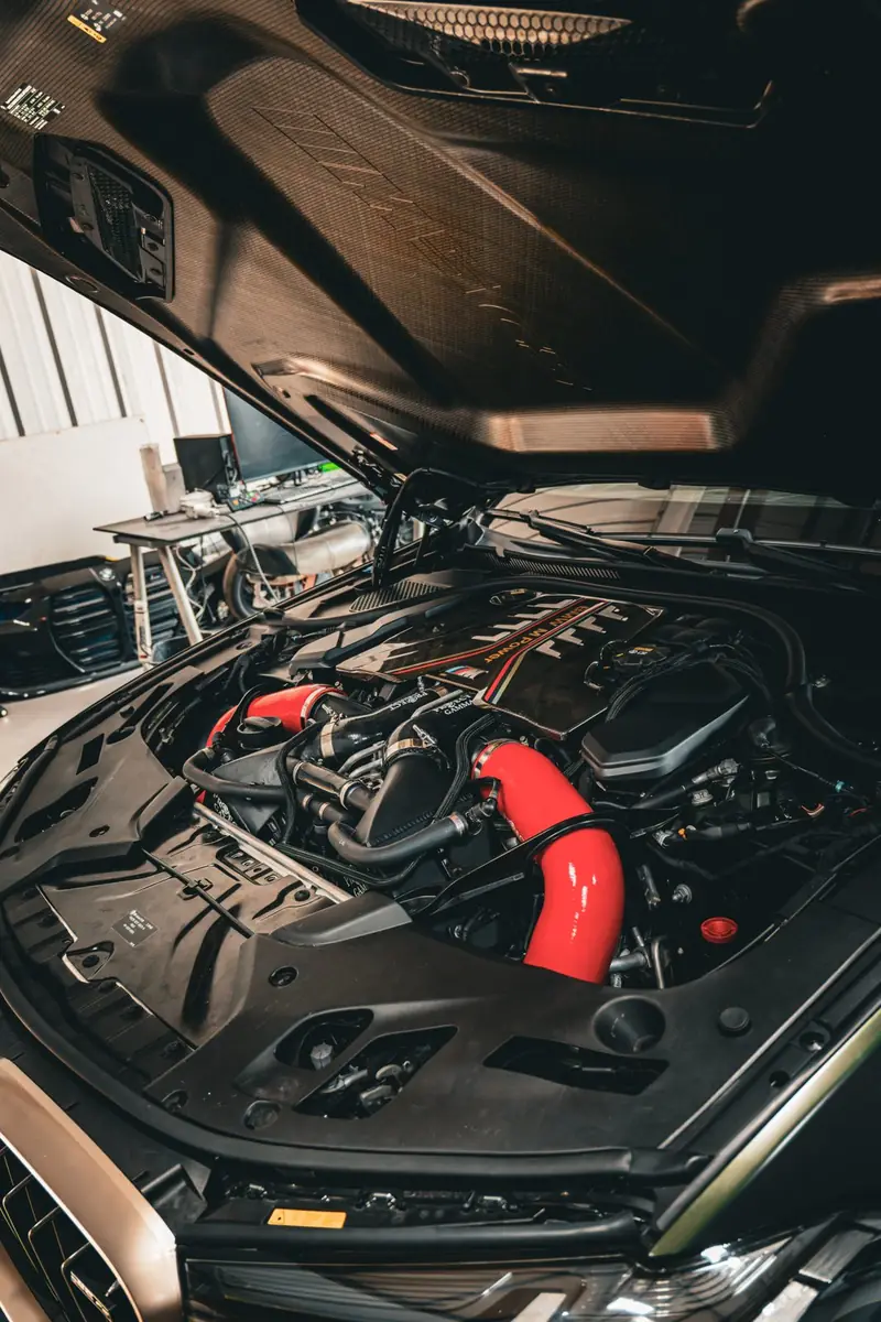 Twin-turbo BMW engine bay being serviced at Cruz Automotive
